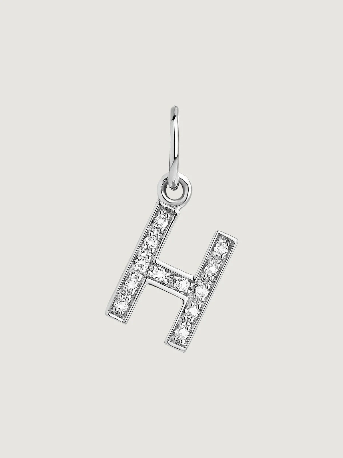Charm de plata 925 y topacios blancos inicial H